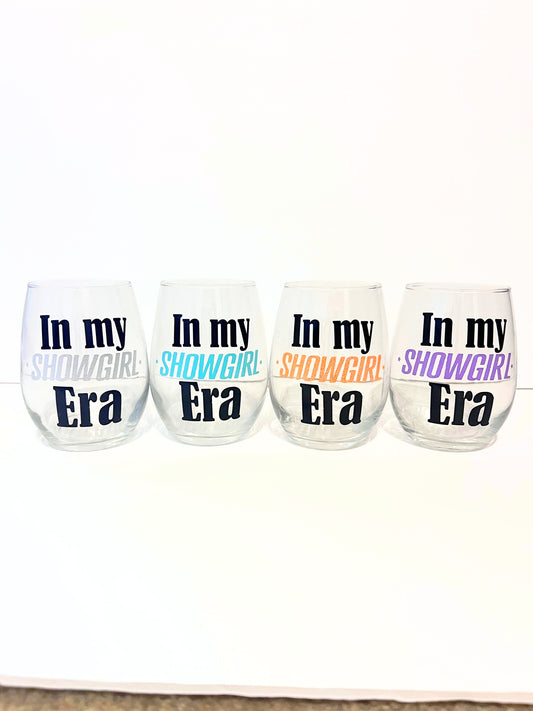 Life of a Showgirl Era colors with sparkles on stemless 20 oz wine glasses
