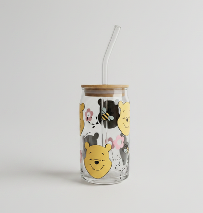 Glass tumbler with Winnie the Pooh design on a white background