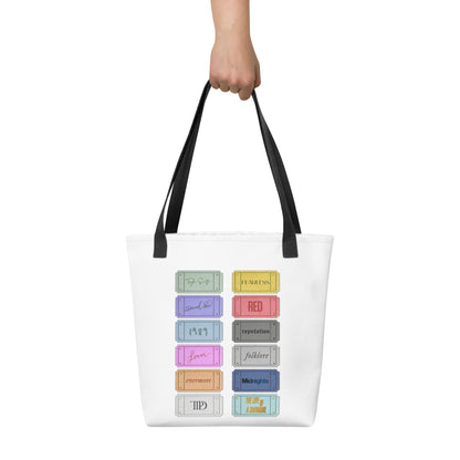 white Taylor 12 album shopping bag with all albums listed with black handles