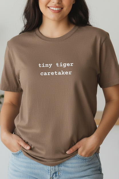 Girl wearing Tiny Tiger Caretaker espresso tee
